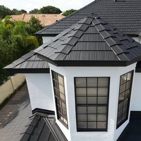 <div><h4>A Metal Roof to Last 4</h4><p><b>Manufacturer:</b> Vicwest Building Products</p><p><b>Location:</b> Florida, US</p><p><b>Style:</b> Metal Shake</p><p><b>Material:</b> Aluminum</p><p><b>Color:</b> Black</p><p><a href="/gallery/image-detail/1345/" class="link-arrow text-uppercase theme-color--orange" data-toggle="modal" data-target="#detailModal_gallery_image_grid_lamlejqhdgHs">View More</a></p></div>