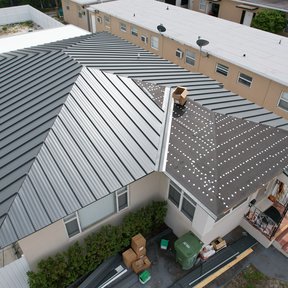 <div><h4>Metal roof Install in progress Miami</h4><p><b>Manufacturer:</b> ASP Superhome</p><p><b>Location:</b> Florida, US</p><p><b>Style:</b> Vertical Panel/Standing Seam</p><p><b>Color:</b> Gray</p><p><a href="/gallery/image-detail/1140/" class="link-arrow text-uppercase theme-color--orange" data-toggle="modal" data-target="#detailModal_gallery_image_grid_lamlejqhdgHs">View More</a></p></div>